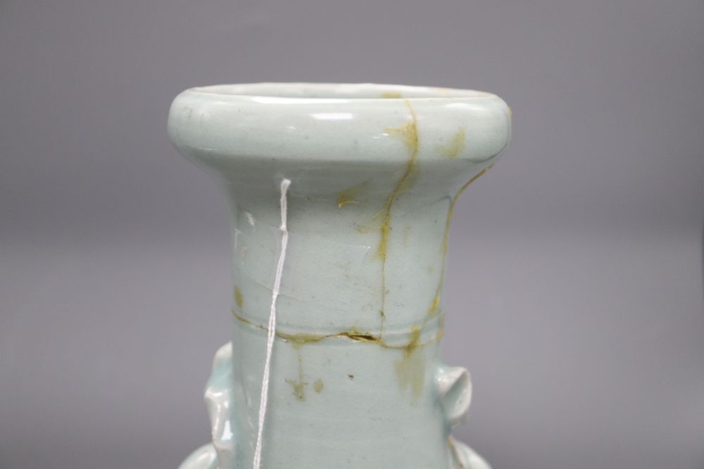 A 17th century Chinese celadon glazed vase, height 26.5cm (a.f) and a pin dish